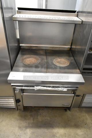 Stainless steel Jade 2-burner gas range with oven, over-shelf, and backsplash on commercial casters. Visible Jade logo.