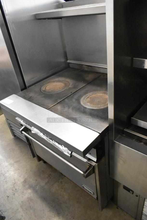 Jade Range stainless steel commercial 2-burner gas range with oven, over-shelf, backsplash, and casters.
