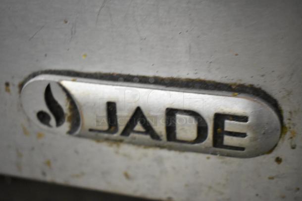 Jade Range stainless steel commercial gas range, 2 burners, oven, over shelf, back splash, on casters. Logo visible.