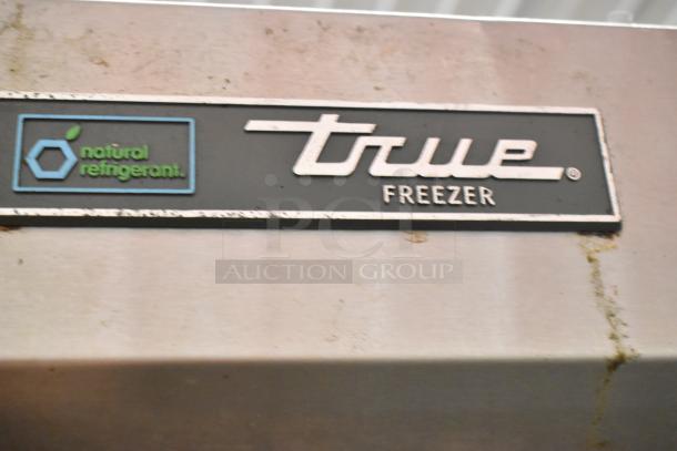 True T-23F-HC stainless steel commercial freezer label, featuring "natural refrigerant" marking. Visible wear present.