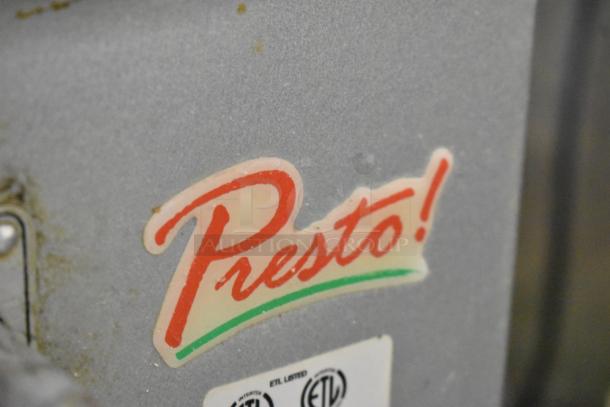 Presto PM-20 metal commercial 20-quart dough mixer with bowl guard, 115 volts, 1 phase. Presto logo visible. Condition appears used.