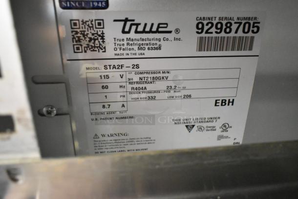 2018 True STA2F-2S stainless steel commercial 2-door freezer label, showing compressor model, voltage, and serial number.