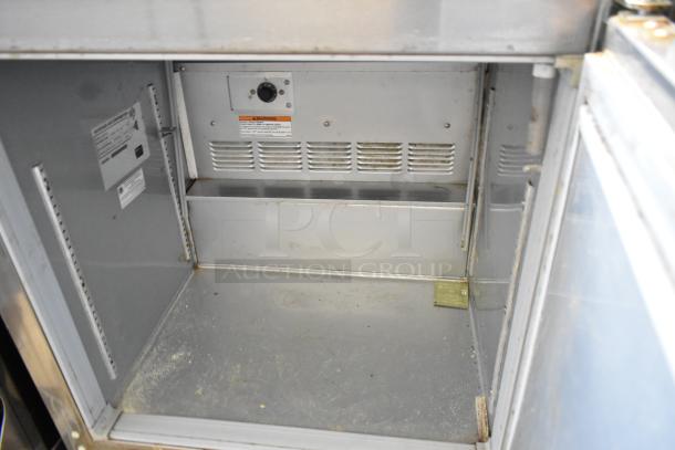Beverage Air UCF27A-23 stainless steel undercounter freezer interior, visible dials, clean surface, commercial casters. 115V, 1 phase.