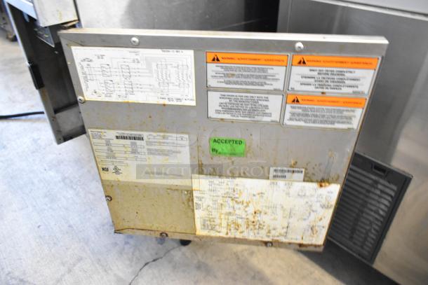2018 Pitco Frialator SE14 stainless steel floor electric fryer with labels, 208V, 3 Phase, includes 2 metal fry baskets.
