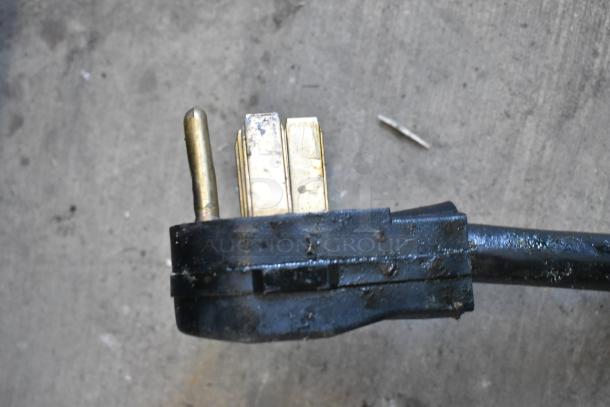 Close-up view of the plug for a 2018 Pitco Frialator SE14 electric fryer. Plug shows signs of use.