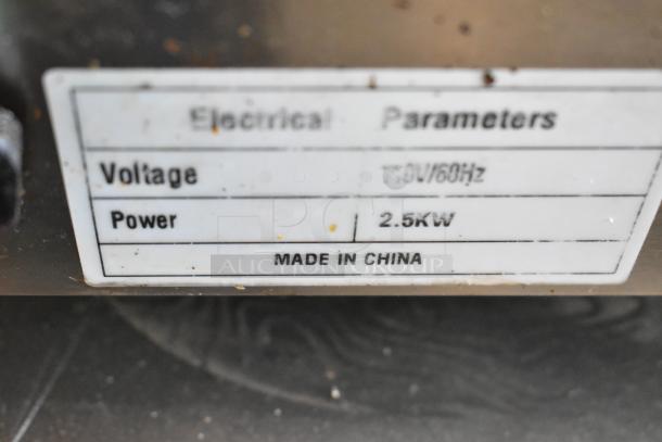 Label on a stainless steel commercial electric griddle, 110V, 2.5kW, Made in China.