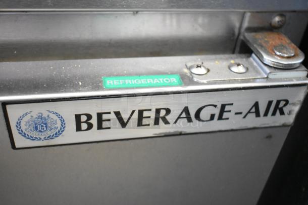 Beverage Air UCR34HC stainless steel commercial 2-door undercounter cooler, visible "Refrigerator" label, on casters.