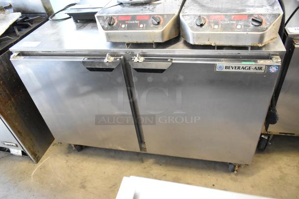 Beverage Air stainless steel 2-door undercounter cooler on casters. Features 115 volts, 1 phase, and visible brand label.