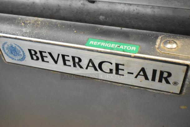 Beverage Air stainless steel 2-door undercounter cooler on casters. "Refrigerator" label visible. 115 volts, 1 phase.