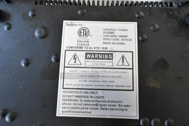 Label of Secura 8100MC Single Burner Induction Range. Shows warnings, model, voltage, and manufacturing details.