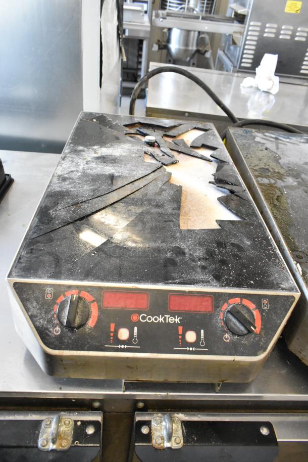 CookTek MC2502F 2 Burner Induction Range showing significant surface damage; cracked and powdered top.