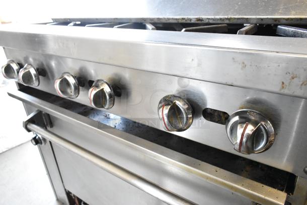 Jade Range J9R-6-36 stainless steel gas range with 6 burners, oven, salamander cheese melter, and backsplash. Used condition.