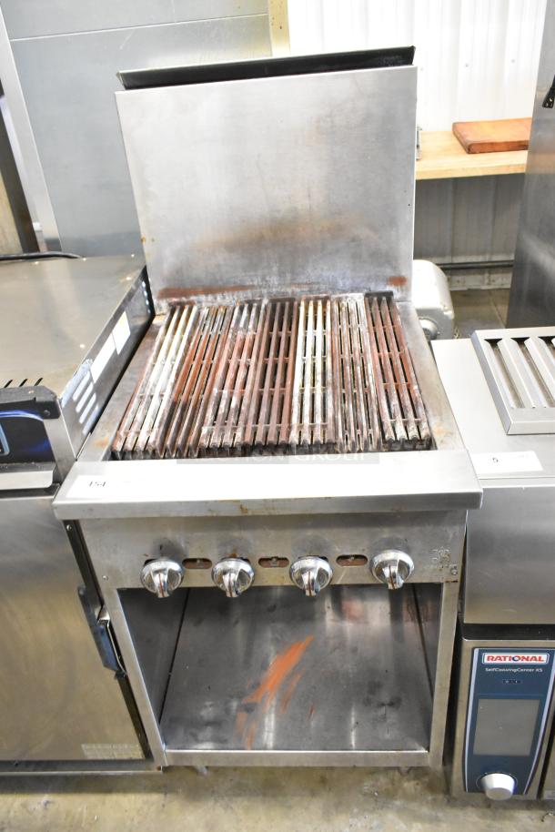 Jade Range JSR-24B stainless steel charbroiler grill, natural gas, with back splash, under shelf, visible wear, four knobs.
