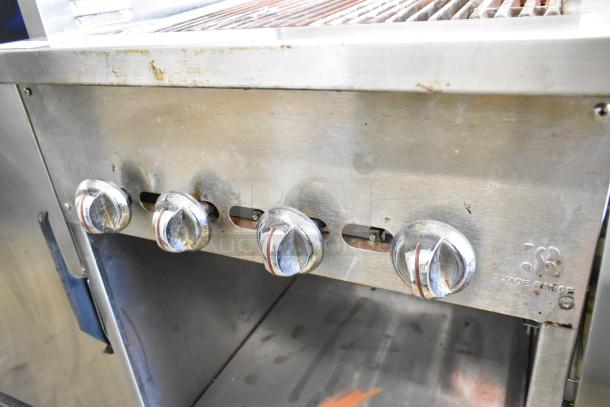 Jade Range JSR-24B stainless steel charbroiler grill with knobs, back splash, and under shelf, natural gas powered, used condition.