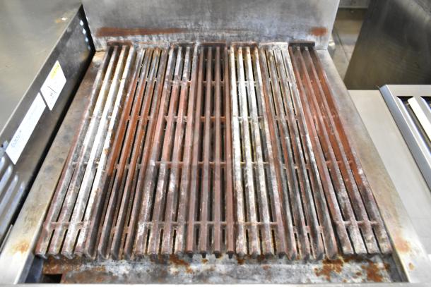 Jade Range JSR-24B charbroiler grill, stainless steel, natural gas, with backsplash and undershelf; visible wear on grates.