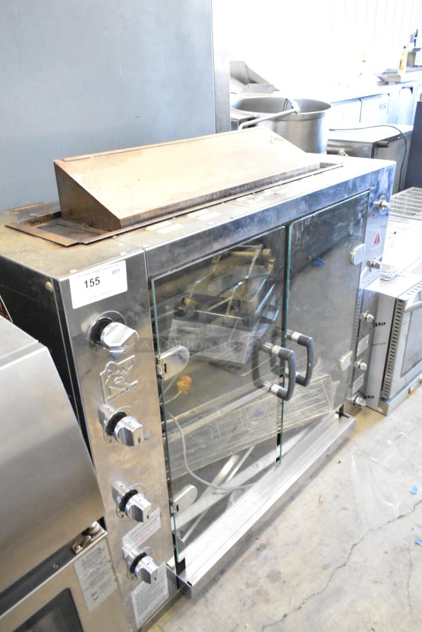 Rotisol 1160.4 commercial rotisserie oven, natural gas powered, metal frame, glass doors, control knobs visible, clean condition.