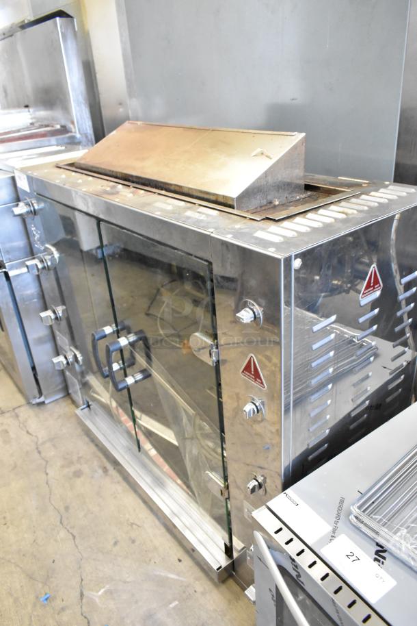Rotisol 1160.4 commercial rotisserie oven, metal construction, glass doors, natural gas powered, used condition.