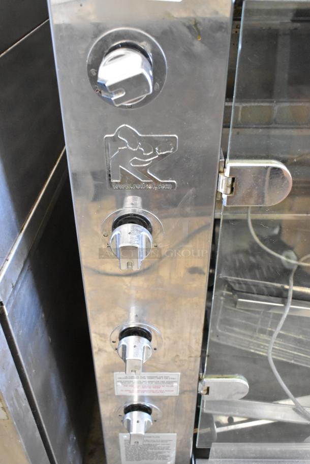 Rotisol 1160.4 metal commercial natural gas-powered rotisserie oven, stainless steel, rotary controls, logo, used condition.