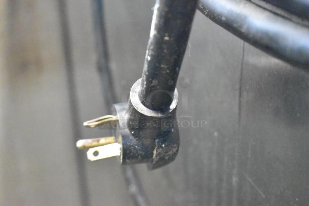 Black power cord plug of CresCor H137WSUA6D heated holding cabinet, showing condition and connector type.