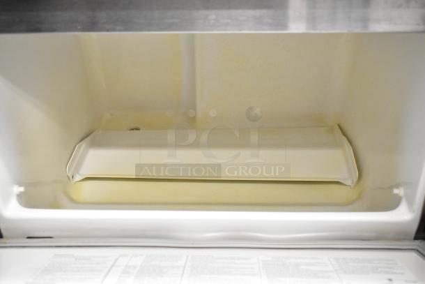Hoshizaki F-330BAJ stainless steel commercial ice machine interior, showing clean, well-maintained condition and spacious chamber.