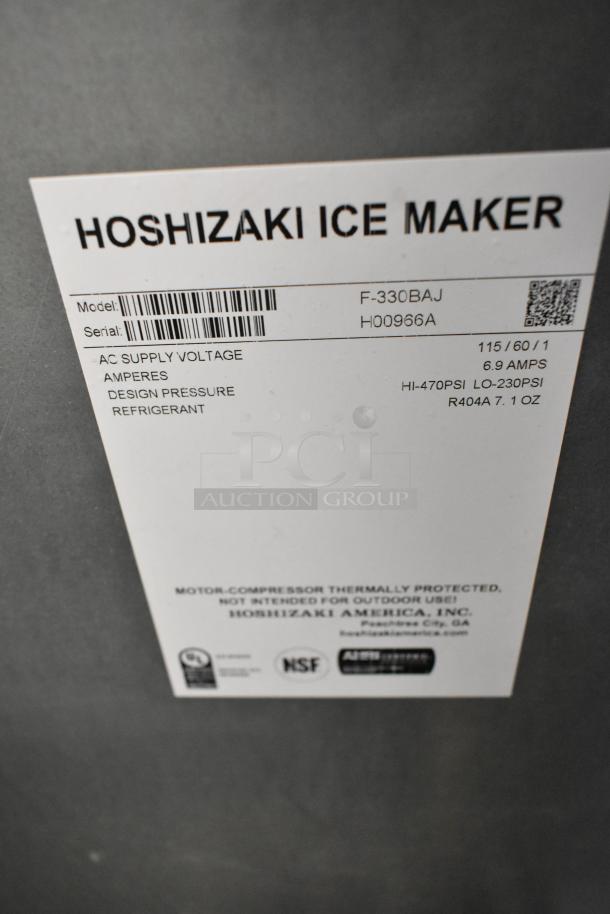 Hoshizaki F-330BAJ stainless steel commercial ice machine, 115V, 1 phase. Model and specifications label visible.