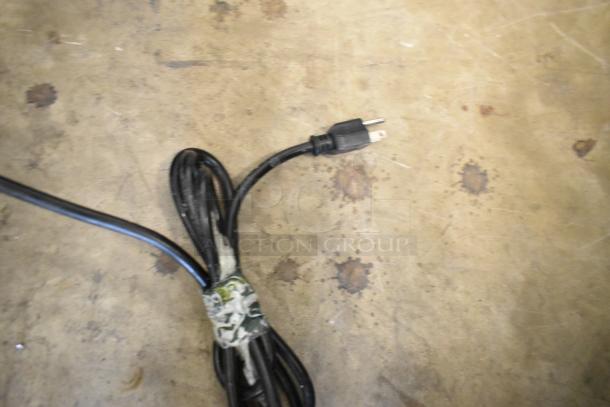 Coiled black power cord of Hoshizaki Sushi Display Case, model HNC-120BA-R-SLH. Condition: used.