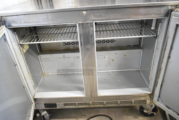 Beverage Air UCR34HC stainless steel undercounter cooler, 2-door, on commercial casters, visible wear, 115V, 1 phase.