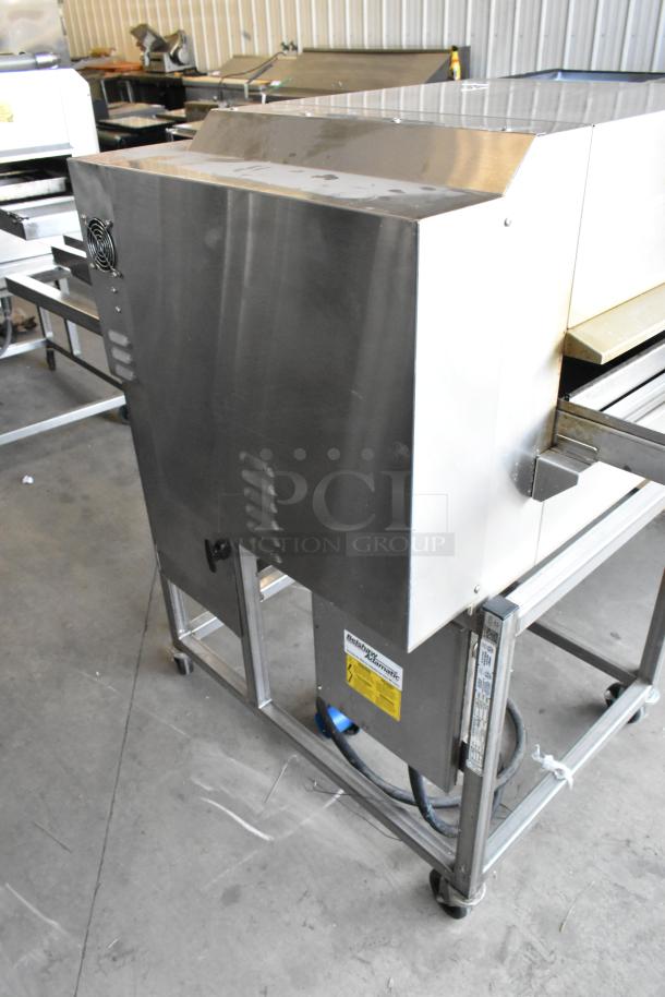 Belshaw TG50 stainless steel thermoglazing station on casters, 208V, 1 phase, used, commercial kitchen setting.