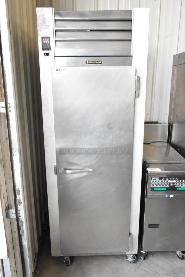 Traulsen G10010 stainless steel reach-in cooler, single door, poly coated racks, commercial casters, 115V, 1 phase.
