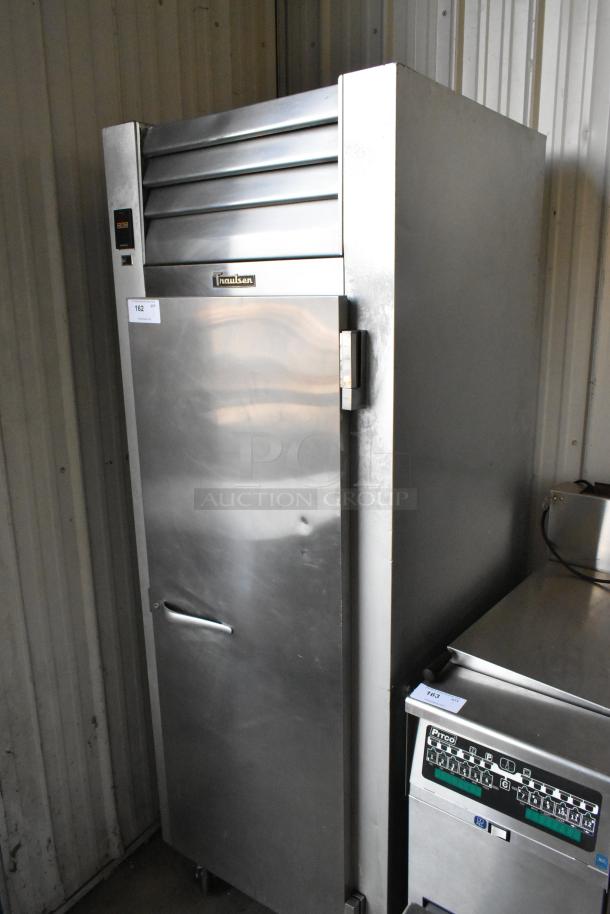 Traulsen G10010 stainless steel commercial single-door reach-in cooler with poly-coated racks and commercial casters. 115 volts.