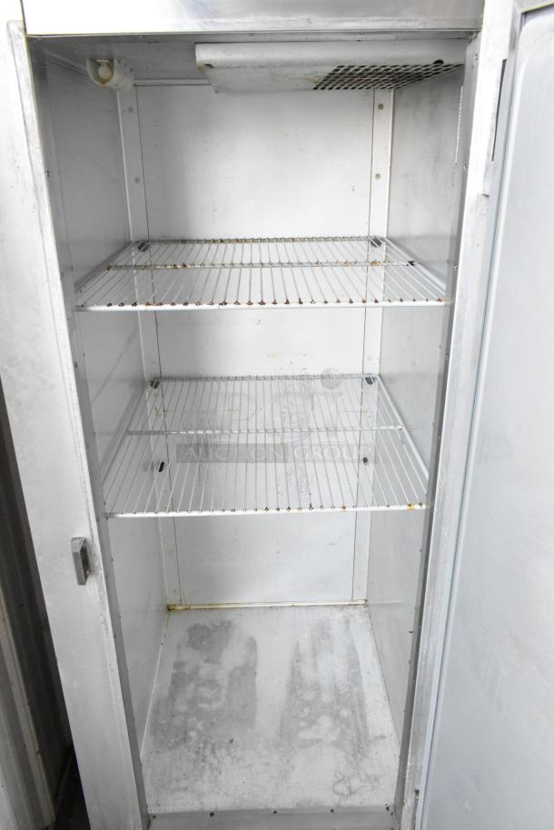 Traulsen G10010 commercial cooler, stainless steel, single door, poly-coated racks, on casters. 115V, 1 phase.