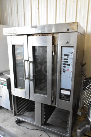 Baxter stainless steel natural gas mini rotating rack oven with double pan rack and commercial casters, used condition.