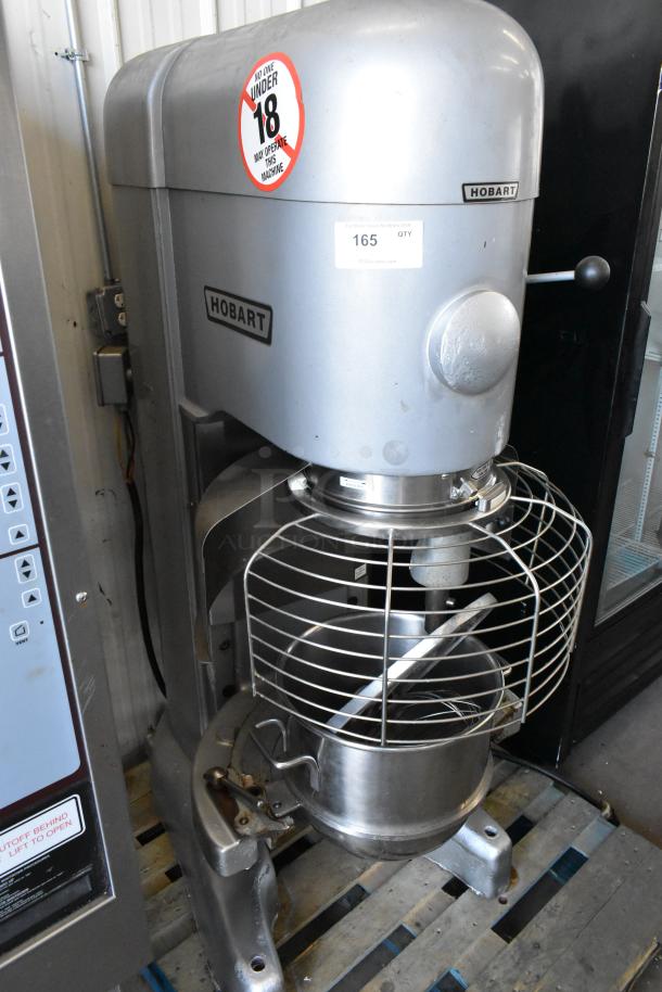 Hobart M802 80-quart commercial dough mixer with metal bowl, whisk, and paddle attachments. 200 volts, 3 phase. Good condition.
