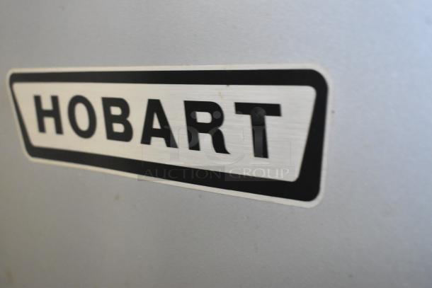 Hobart M802 logo on metal surface. Part of 80-quart commercial planetary dough mixer, includes bowl, whisk, paddle, 200V, 3 phase.