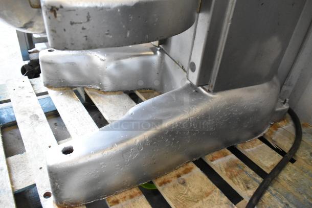 Hobart M802 commercial floor mixer base with metal finish, mounted on a wooden pallet. Condition shows signs of wear. 80-quart capacity.