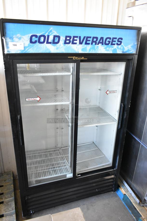 True GDM-41 metal 2-door reach-in cooler, features poly-coated racks, commercial casters, and "Cold Beverages" signage.