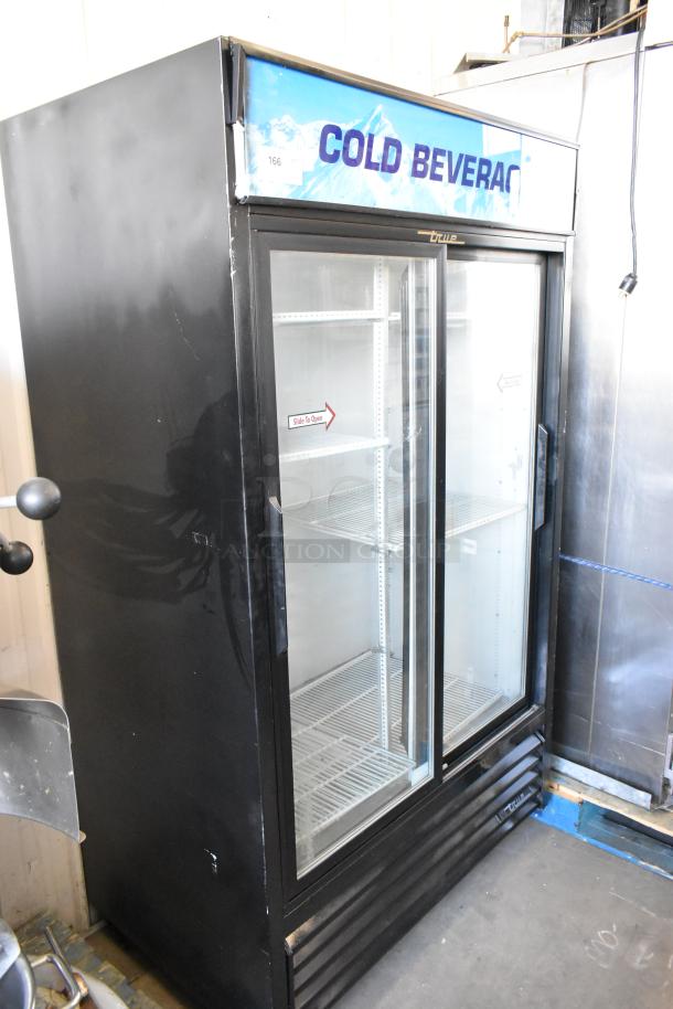 True GDM-41 commercial 2-door cooler, poly-coated racks, on casters. 115V, 1 phase. "Cold Beverage" header. Good condition.
