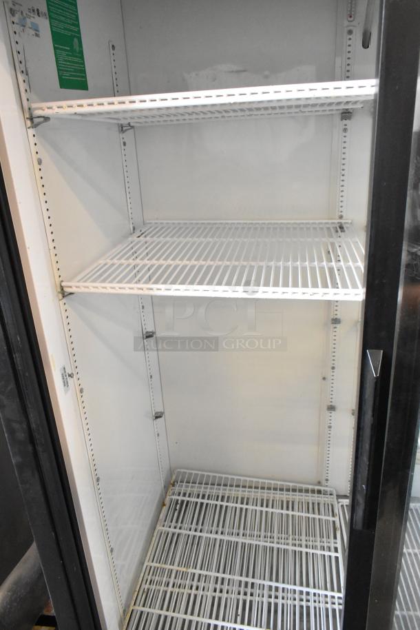 True GDM-41 commercial cooler, 2 glass doors, poly-coated racks, on casters. 115V, 1 Phase. Interior is clean and spacious.