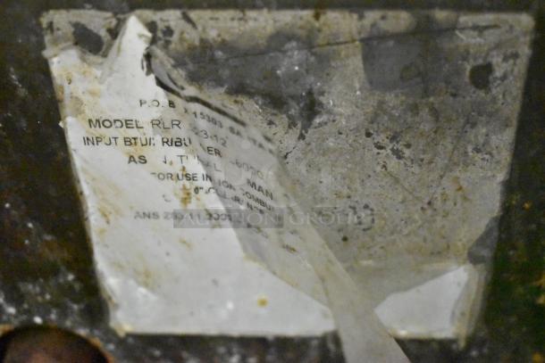 RLRM-23-12 stainless steel charbroiler label, showing model details and input BTU; used, weathered condition.