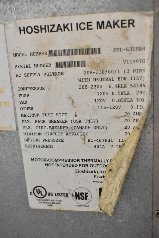 Hoshizaki KML-631MAH stainless steel commercial ice head on bin, 208-230V, showing label with model and specs.