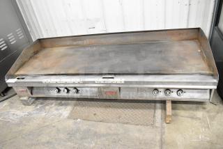 Lang Stainless Steel Commercial Countertop Flat Top Griddle in used condition with controls. Features Lang branding.
