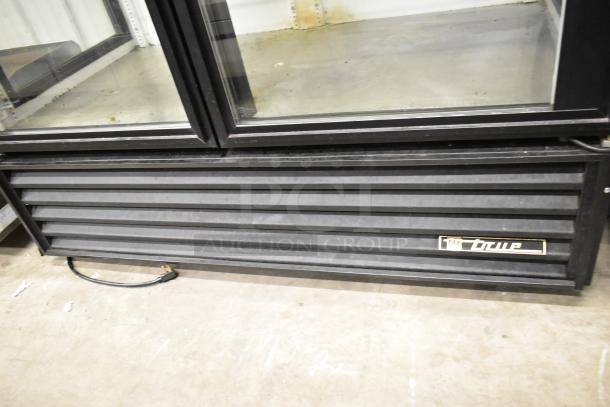 True GEM-49 commercial 2-door cooler, poly racks, 115V, 1 phase, black metal exterior, visible True logo, used condition.