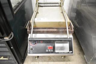 Star Pro-Max CG14IT stainless steel commercial panini press, countertop model, 120V, 1 Phase. Features timer controls.