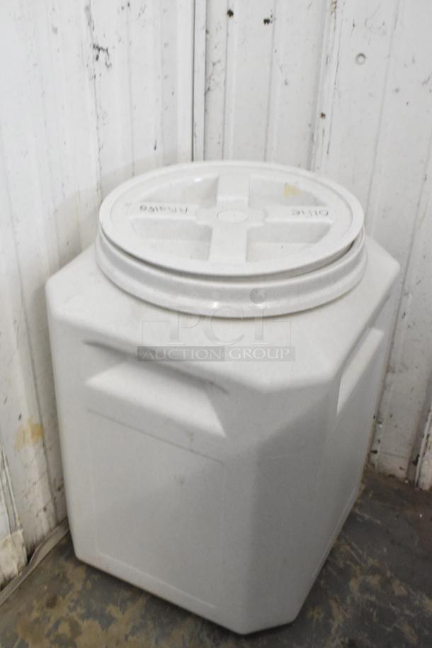 White poly bin with secure lid, sturdy construction, visible minor scuffs, ideal for storage. Auction for two bins.