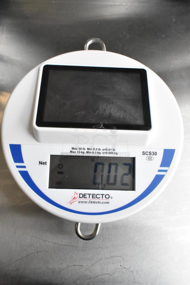 Brand new Cardinal Detecto SCS30 solar-powered 30 lb. hanging scale, digital display, slight scratches, max 30 lb, model labeled.