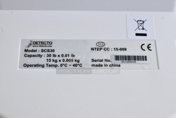 Brand new Cardinal Detecto SCS30 solar-powered hanging scale, 30 lb capacity. Model details and serial number shown.