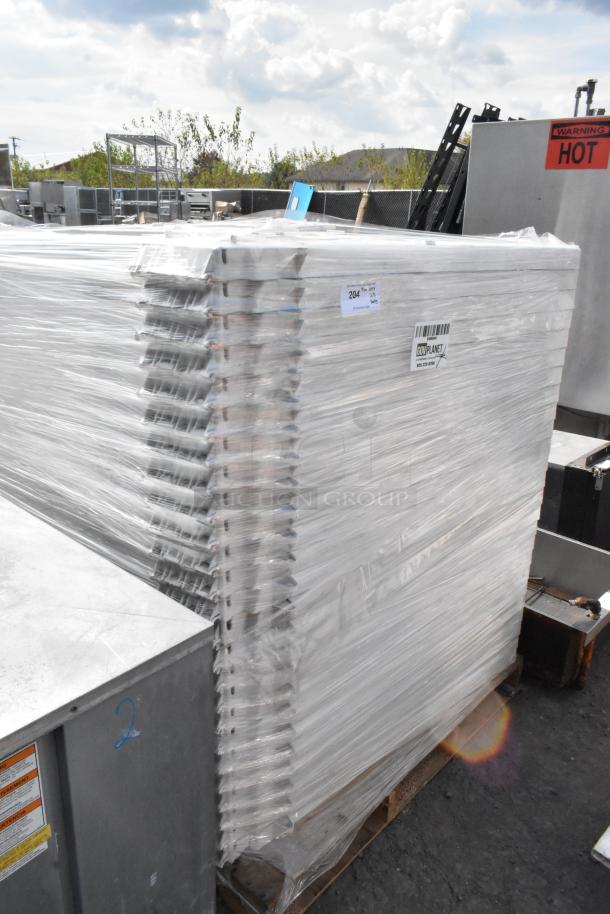 25 wrapped white units stacked, palletized for auction. Barcode and label indicate lot number 204. 25 times bid value.
