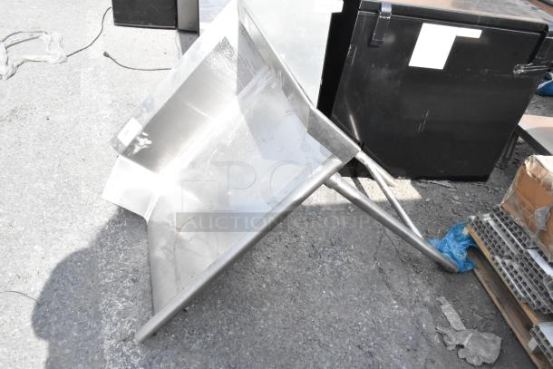 Stainless steel right-side clean side dishwasher table, used condition, with sturdy metal legs and a slightly angled surface.
