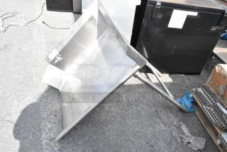 Stainless steel right-side clean side dishwasher table, used condition, with sturdy metal legs and a slightly angled surface.
