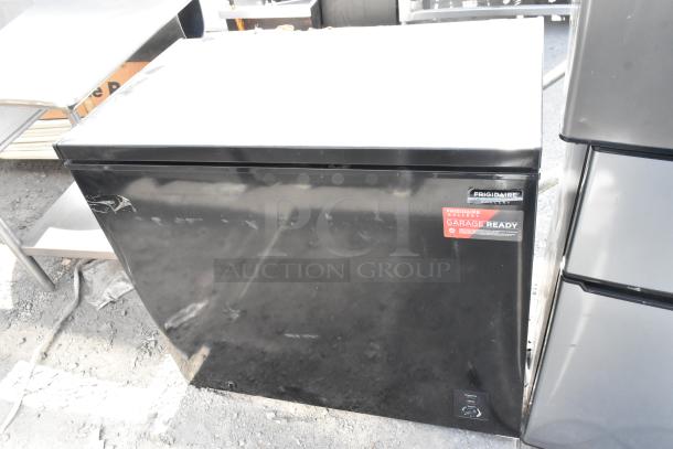 Frigidaire chest freezer, black, with "Garage Ready" label. 115 volts, 1 phase. Auction includes 3 times your bid.